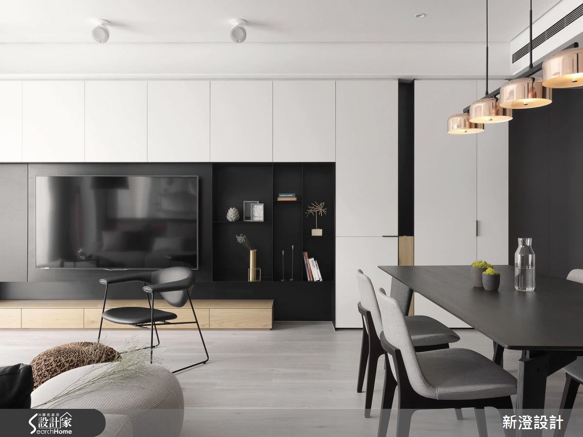 52 坪居家，設計師引用經典的黑白色調，在低彩主調中